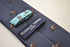 navy tie with horse racing pattern